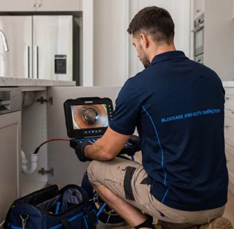 Clearing a blocked sink at a Double Bay property